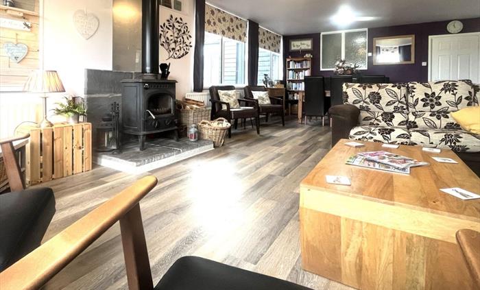 Our comfortable lounge, has a smart TV, wood burner and we provide free wifi. A great place to rest after a great day, walking, mountain biking, kayak
